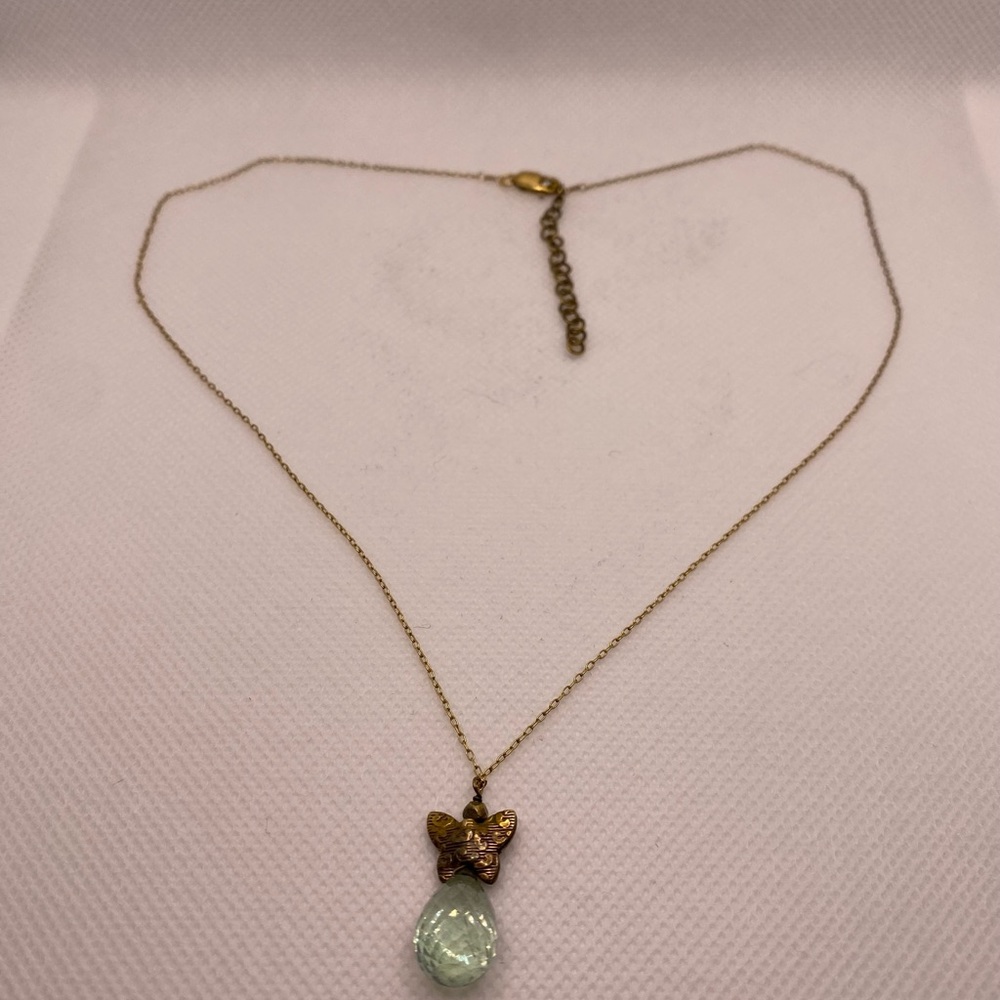 Gold necklace with butterfly & crystal.